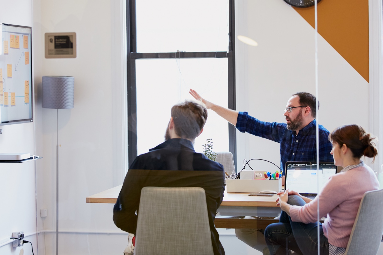 Team mapping out AI opportunity areas on a whiteboard