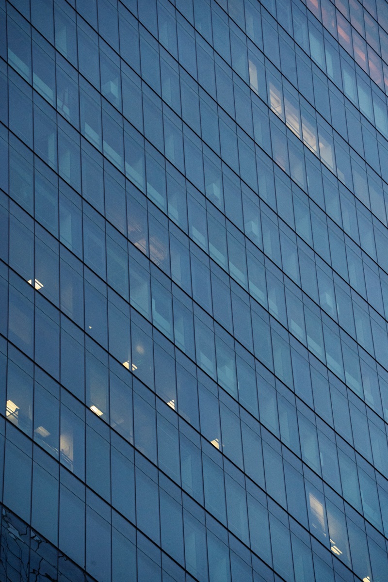 Glass facade of a modern corporate office building