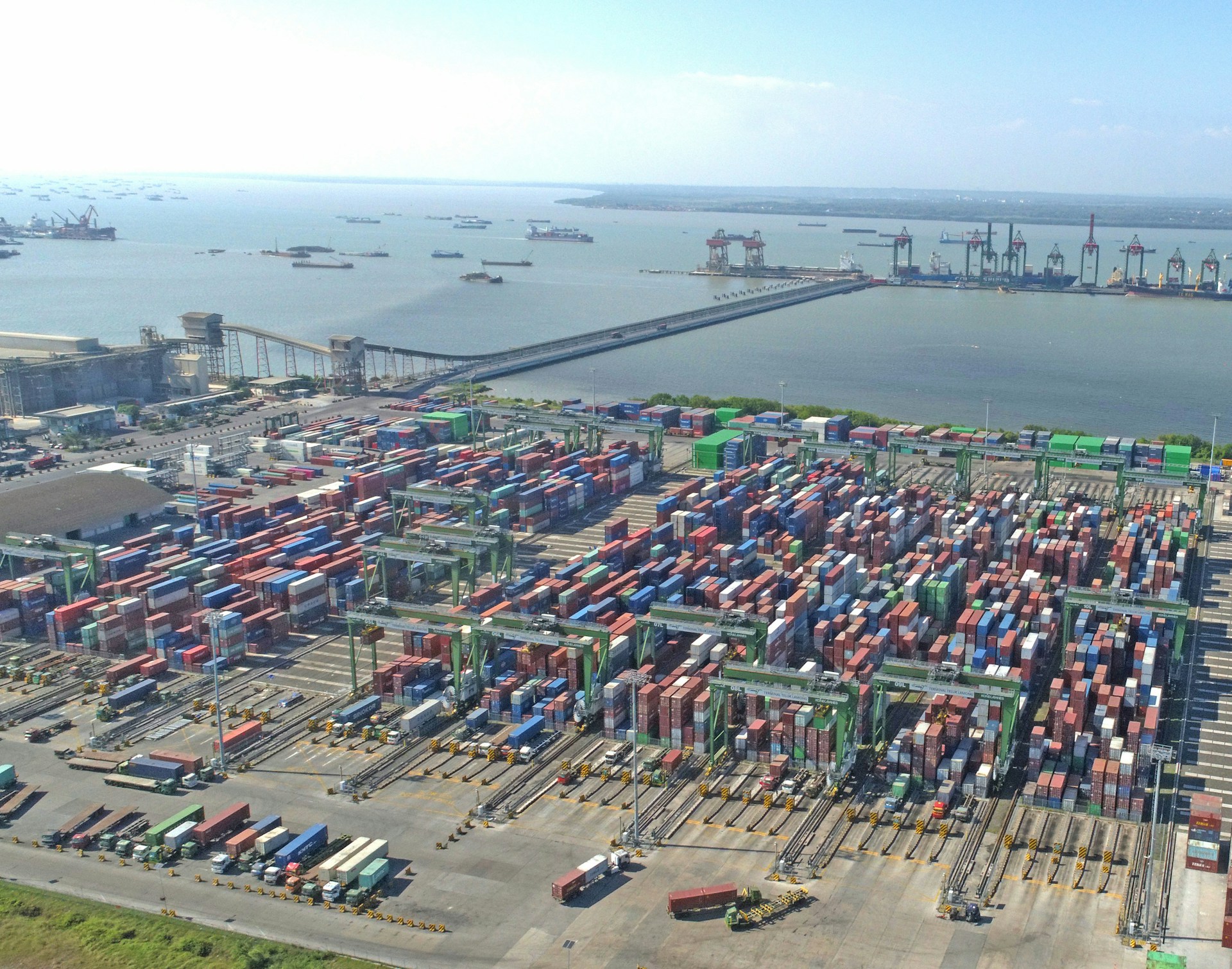Aerial view of a busy shipping port with cargo containers