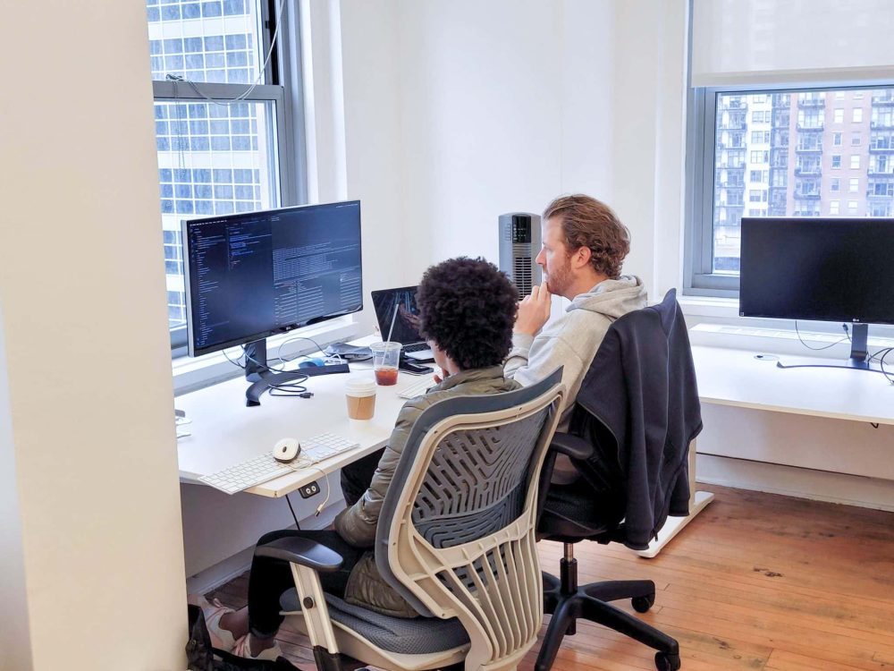 Beyond Finance and Made In Tandem development team collaborating in person